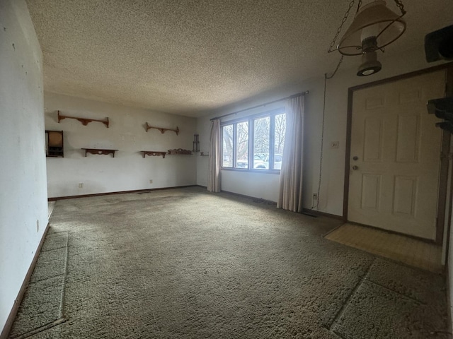 interior space with carpet flooring and a textured ceiling