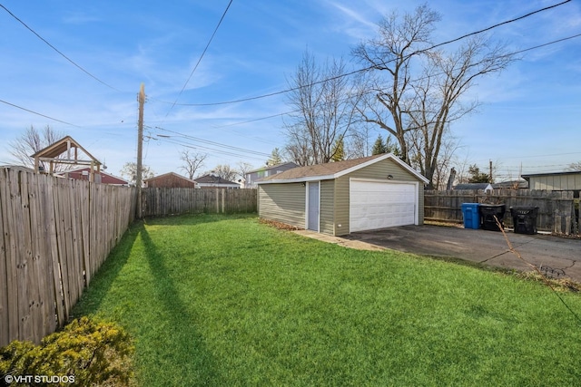 view of yard featuring an outbuilding and a garage