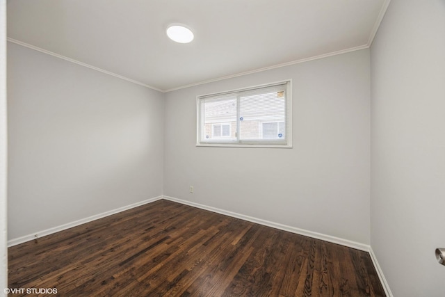 unfurnished room with dark hardwood / wood-style flooring and ornamental molding