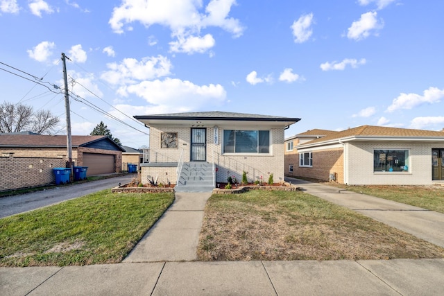 bungalow-style home featuring a garage and a front lawn