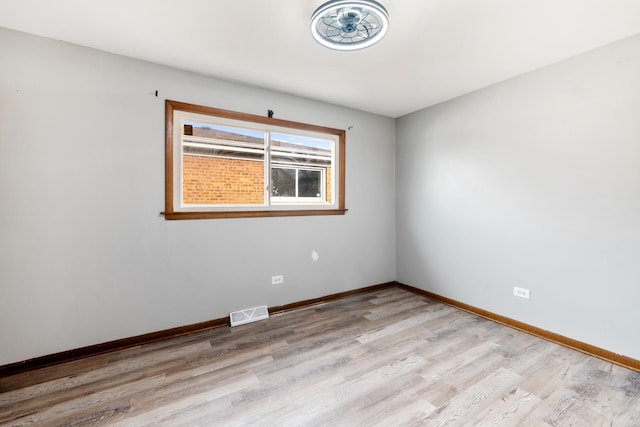 unfurnished room featuring light hardwood / wood-style floors