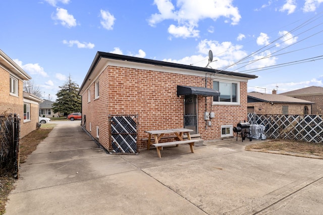 rear view of house with a patio