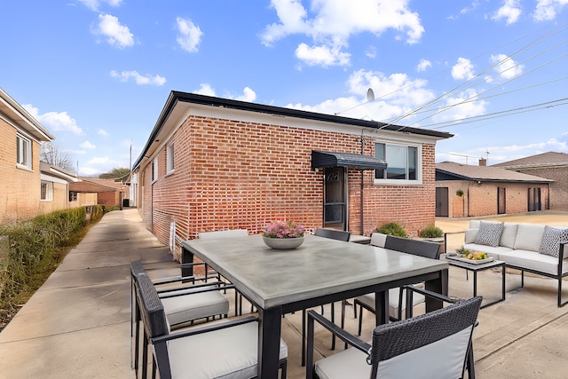 rear view of property with a patio area and an outdoor hangout area