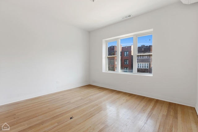 empty room with light hardwood / wood-style floors