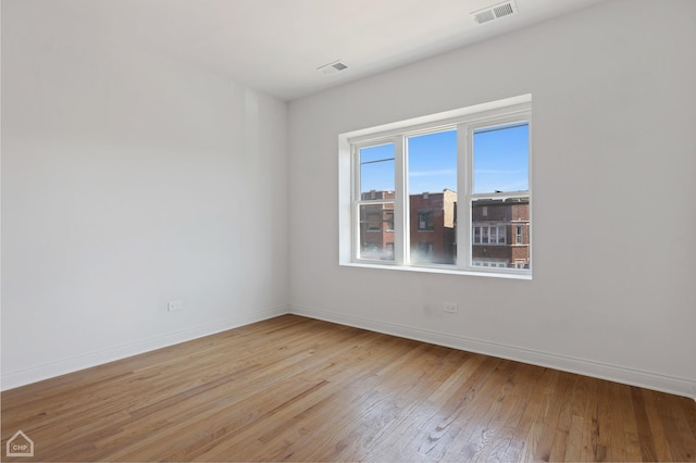 unfurnished room with light hardwood / wood-style flooring