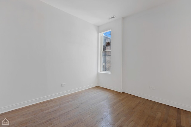 unfurnished room with light hardwood / wood-style floors