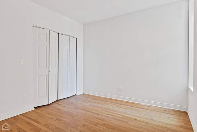 unfurnished bedroom with light wood-type flooring