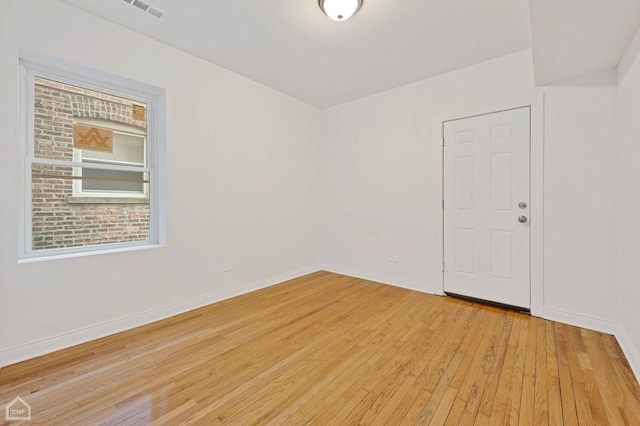 unfurnished room with light hardwood / wood-style floors