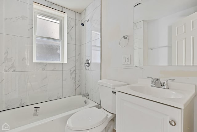 full bathroom featuring vanity, toilet, and tiled shower / bath combo