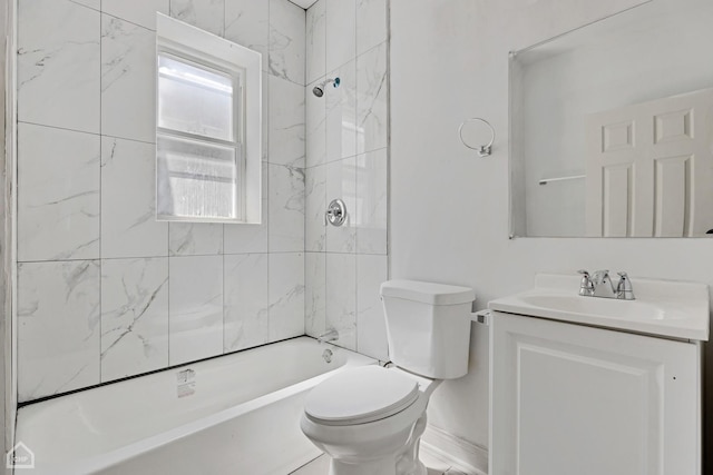 full bathroom featuring vanity, toilet, and tiled shower / bath combo