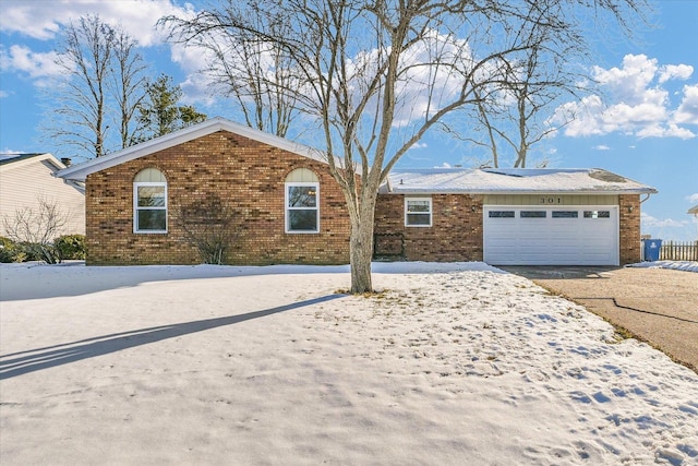 ranch-style home featuring a garage