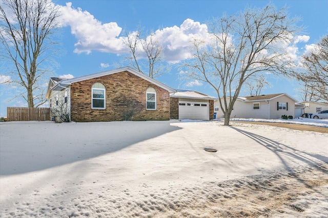 single story home with a garage