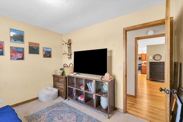 interior space with carpet floors and a textured ceiling