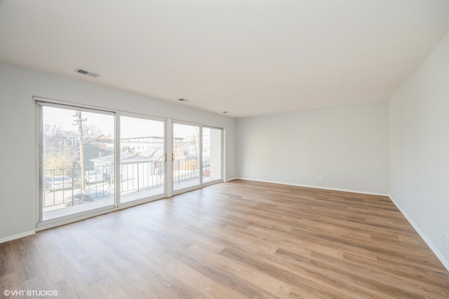 unfurnished room featuring light wood-type flooring