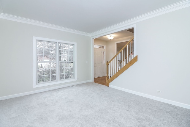 carpeted empty room with ornamental molding