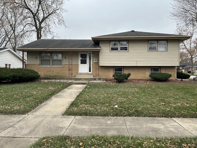 tri-level home featuring a front yard