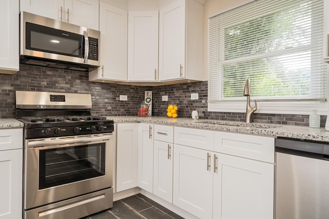 kitchen with stainless steel appliances and white cabinets