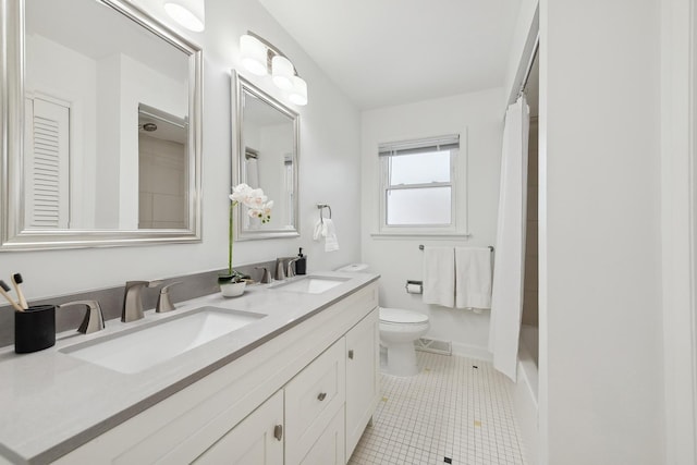 bathroom featuring toilet, walk in shower, tile patterned floors, and vanity