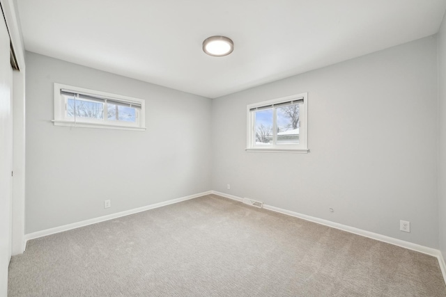 empty room featuring carpet floors