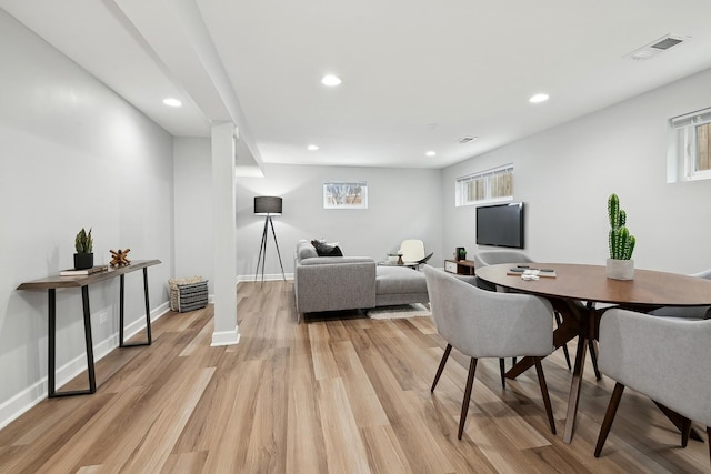 dining space featuring light wood-type flooring