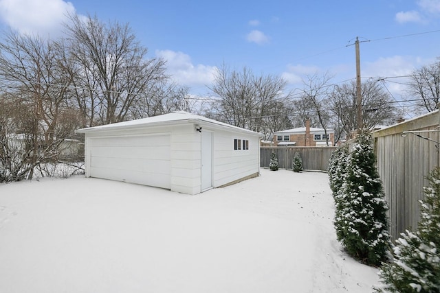 view of snow covered garage