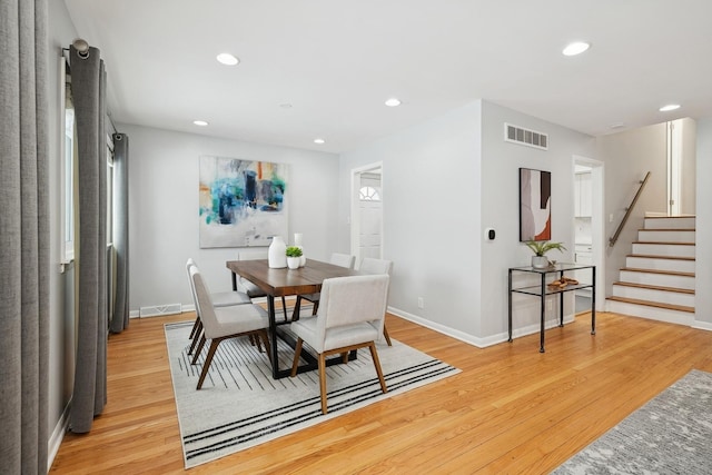 dining room with light hardwood / wood-style flooring