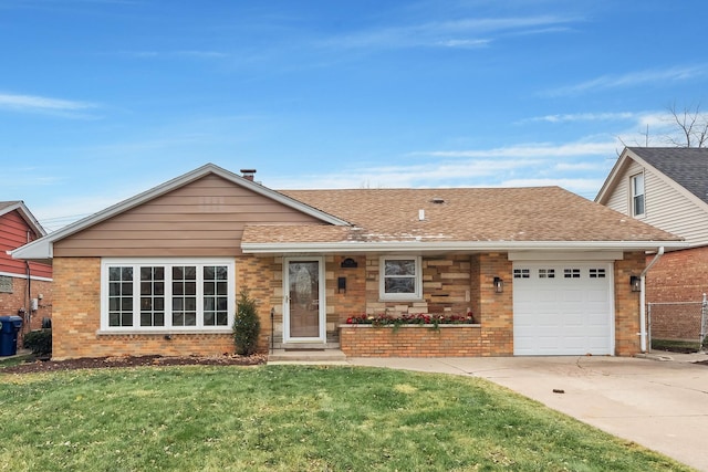 view of front of home with a garage and a front lawn