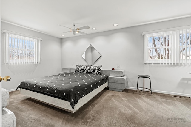 carpeted bedroom featuring ceiling fan