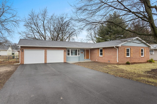 single story home with a front yard and a garage