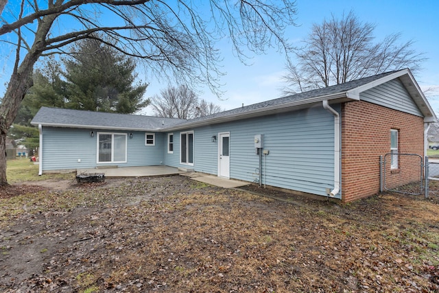 back of house with a patio area