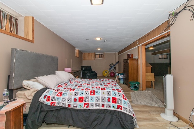 bedroom with light hardwood / wood-style floors