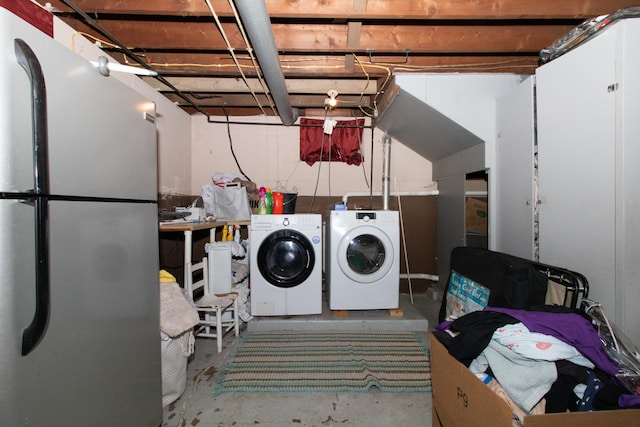 laundry area featuring washing machine and clothes dryer