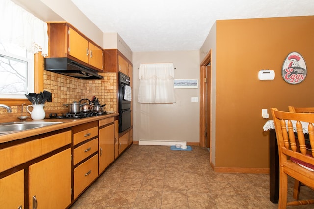 kitchen featuring sink, backsplash, stainless steel gas cooktop, and black double oven