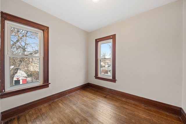 unfurnished room featuring wood-type flooring