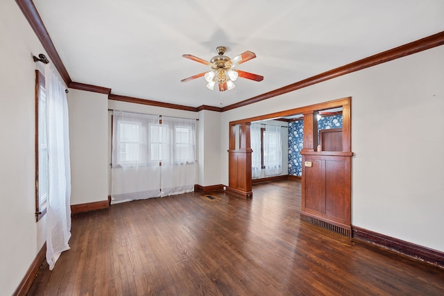 interior space with ceiling fan, dark hardwood / wood-style floors, and crown molding