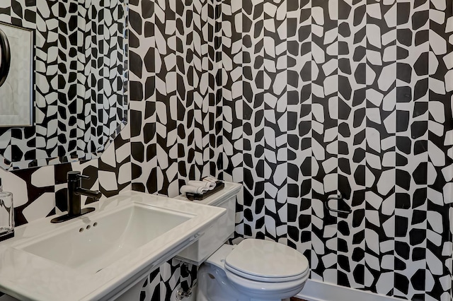 bathroom with sink and toilet