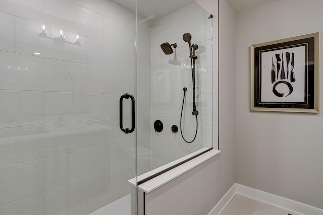 bathroom with a shower with shower door