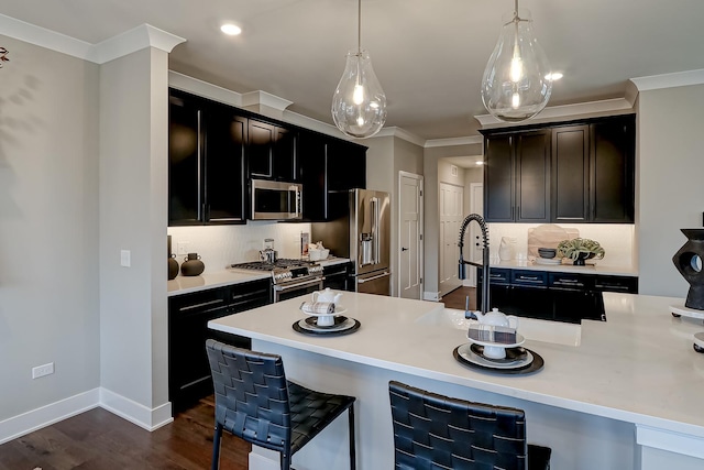 kitchen featuring backsplash, ornamental molding, stainless steel appliances, dark wood-type flooring, and pendant lighting