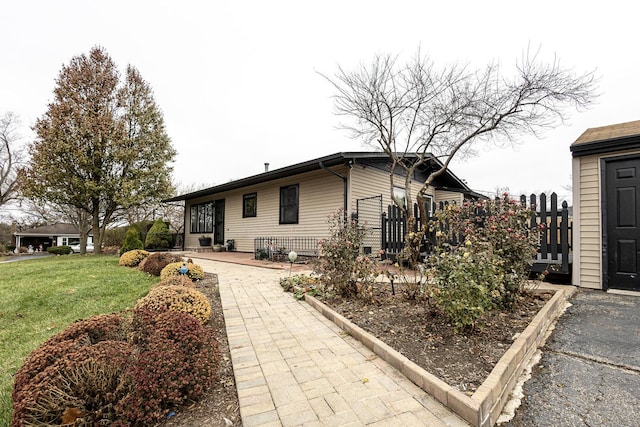 view of home's exterior featuring a lawn