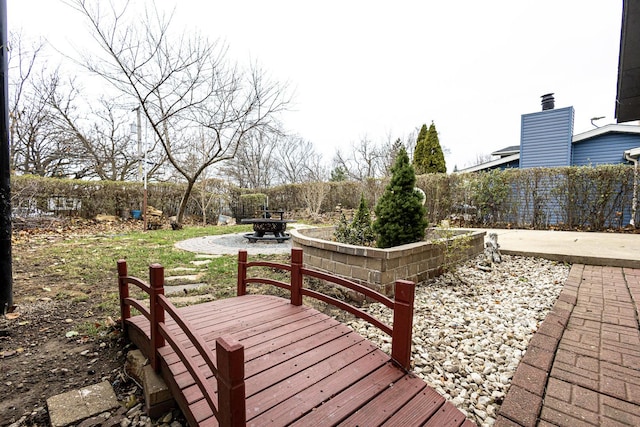 wooden terrace featuring a patio