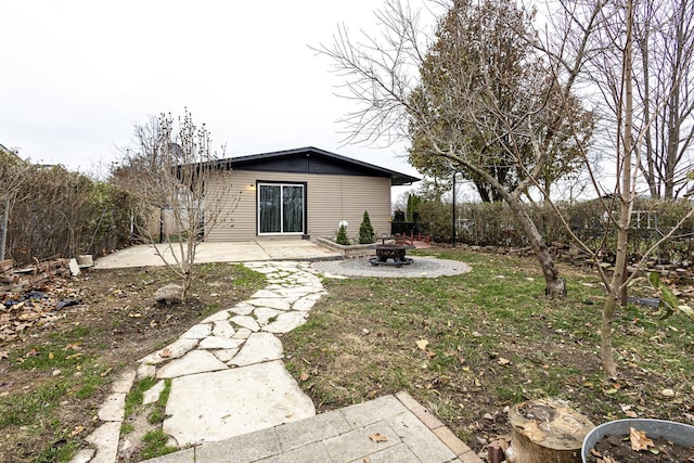 view of yard featuring a patio area and a fire pit