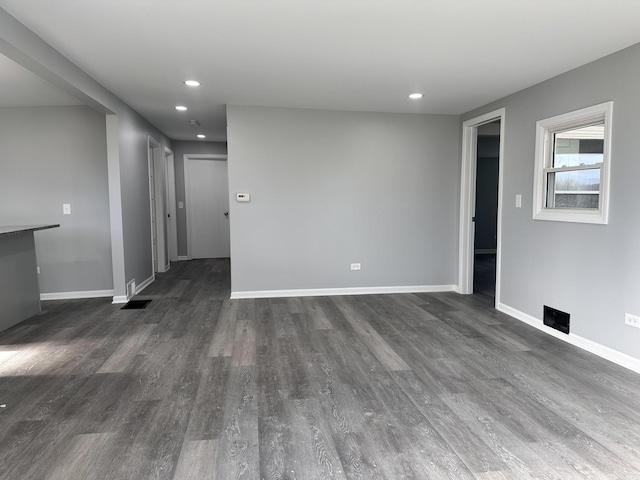 spare room featuring dark hardwood / wood-style flooring