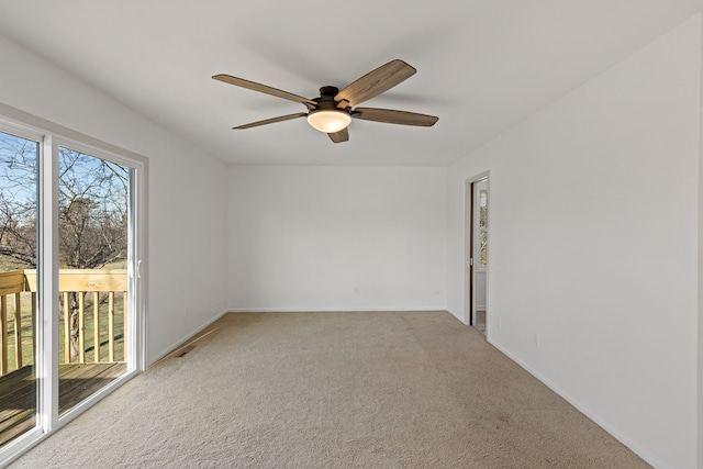 carpeted empty room with ceiling fan