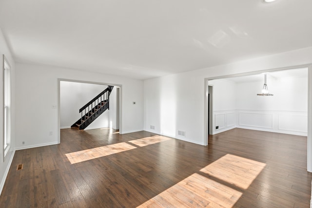 empty room featuring dark wood-type flooring