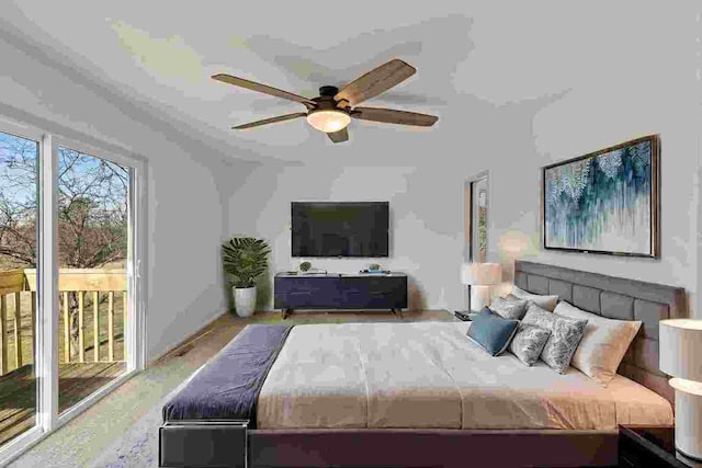 bedroom with access to outside and ceiling fan