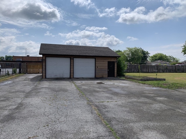 garage featuring a yard