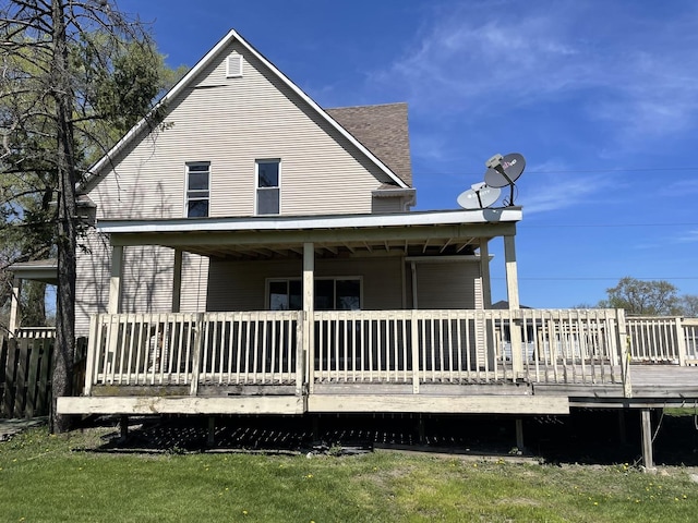 back of property with a deck