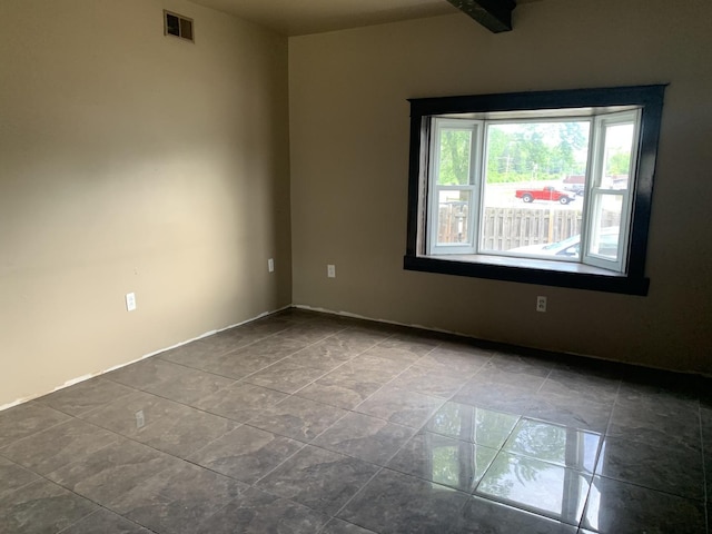 empty room featuring tile patterned flooring