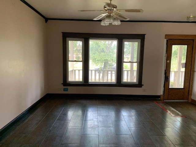 spare room featuring ceiling fan and ornamental molding