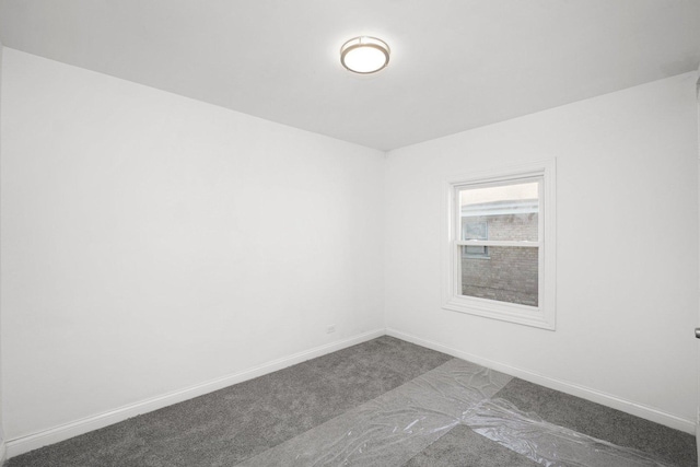 empty room with carpet flooring